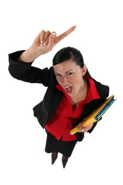 An angry businesswoman. clipart