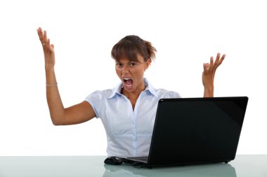 Woman frustrated with her laptop clipart