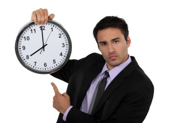 Businessman with a clock clipart