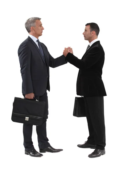 Businessmen gripping hands — Stock Photo, Image