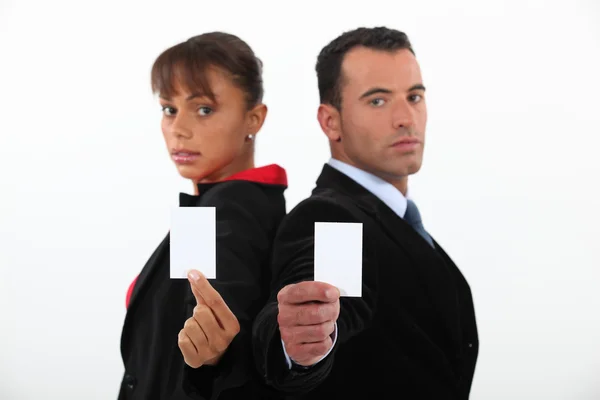 Business professionals holding their business cards — Stock Photo, Image