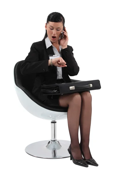 Businesswoman shocked looking at her watch — Stock Photo, Image