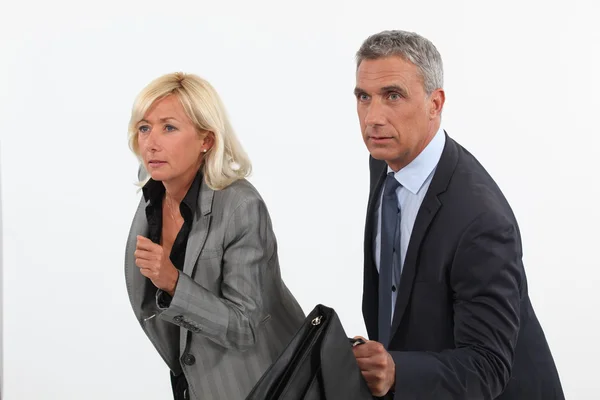 Businessman and businesswoman ready to race — Stock Photo, Image