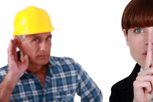 Woman telling builder to be quiet — Stock Photo, Image