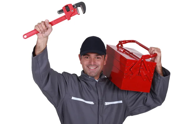 Homem com uma chave inglesa e caixa de ferramentas — Fotografia de Stock
