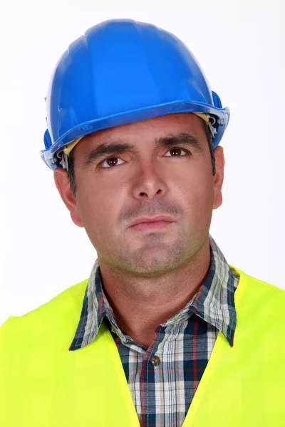 Puzzled construction worker — Stock Photo, Image