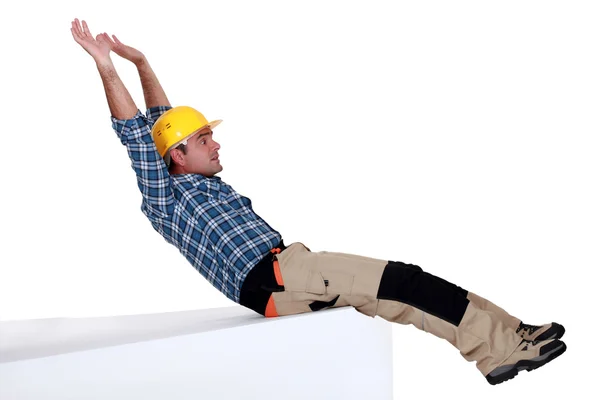 Laborer sliding on white background — Stock Photo, Image