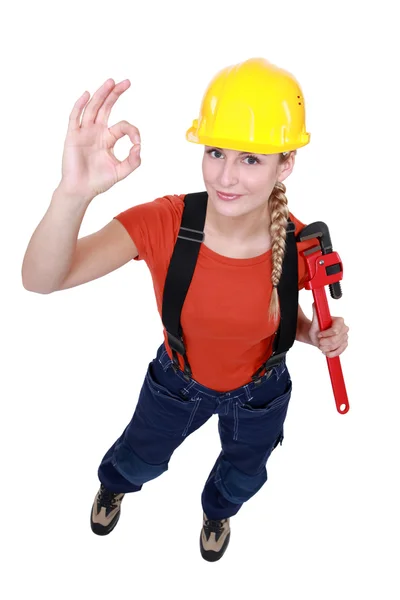 Female plumber giving the OK — Stock Photo, Image