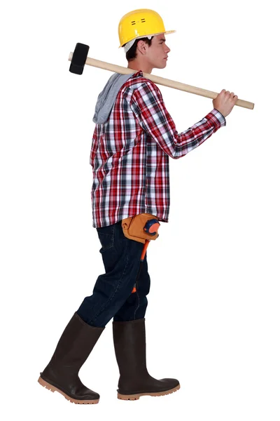 Young worker with a sledgehammer — Stock Photo, Image