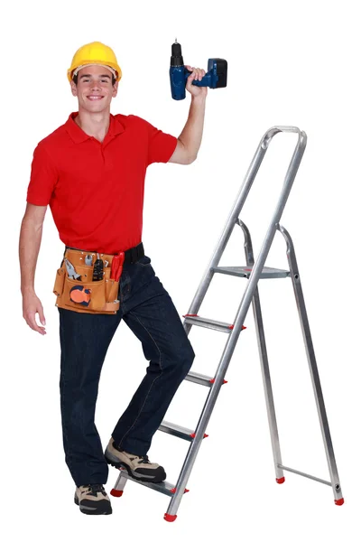 Trabalhador da construção com uma broca — Fotografia de Stock