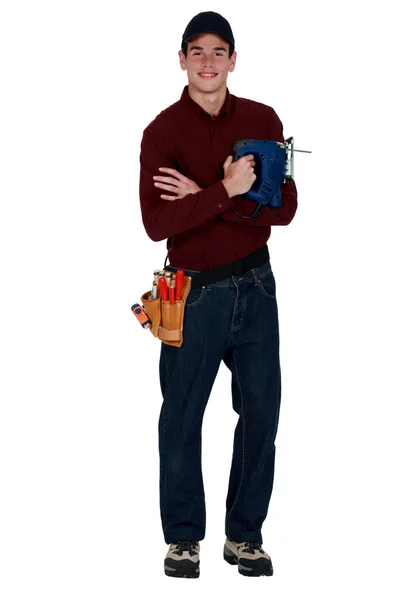 Young man holding a jigsaw — Stock Photo, Image