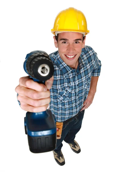 Comerciante sosteniendo una herramienta eléctrica — Foto de Stock