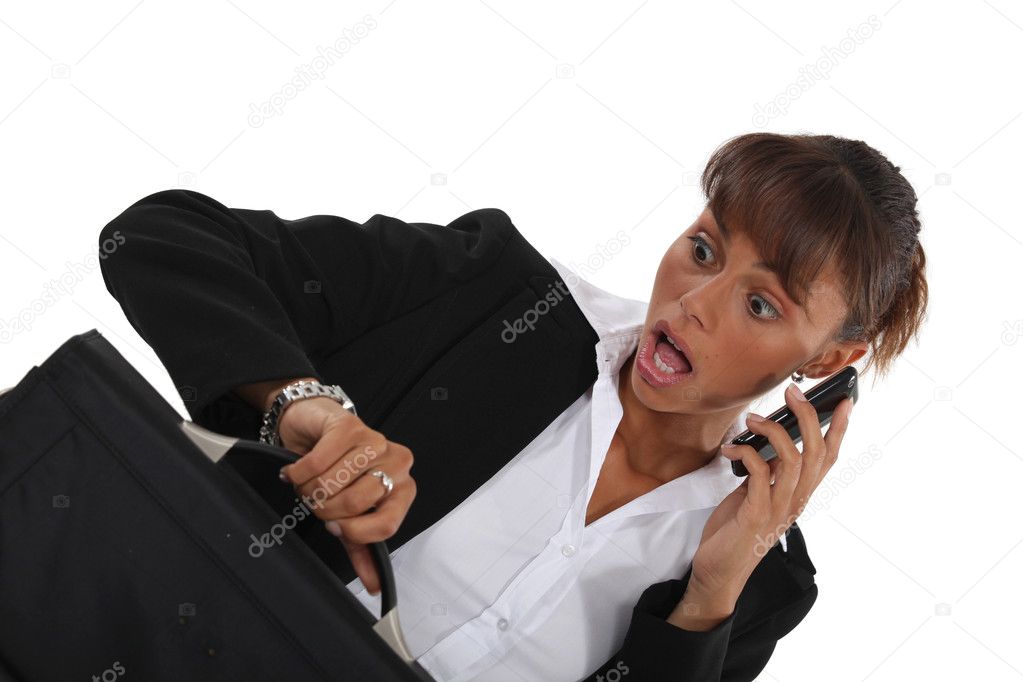 Businesswoman realizing she is late for appointment stock photo