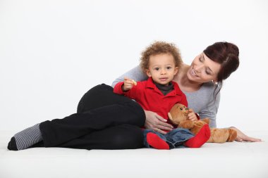 Woman playing with her child clipart