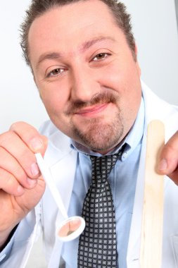 Patient's view of a friendly dentist with a mirror clipart