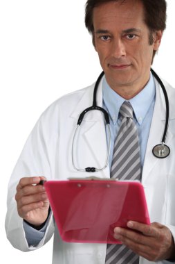 Doctor smiling with clipboard clipart