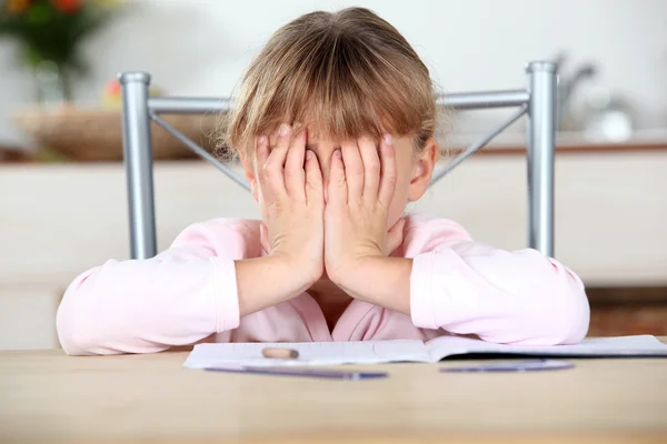 Frustrated child unable to complete her homework — Stock Photo, Image