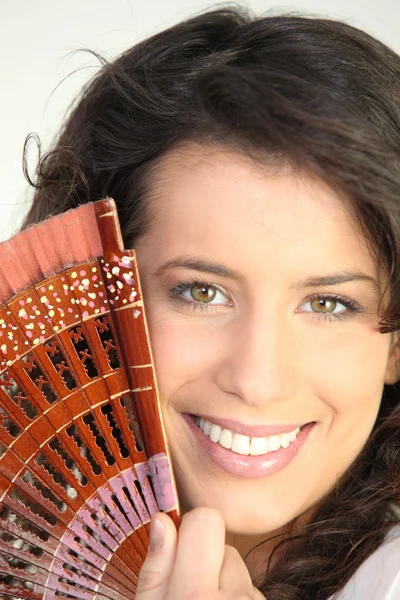 Portrait of woman with fan — Stock Photo, Image