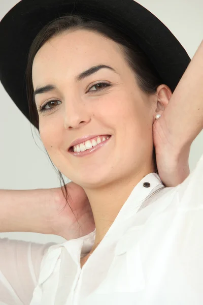 Brunette posing in hat — Stock Photo, Image