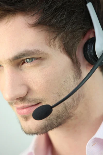 Closeup of a man wearing a headset — Stock Photo, Image
