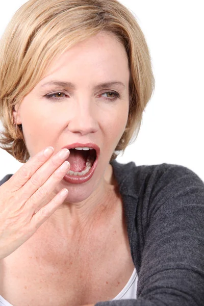 Blond woman yawning — Stock Photo, Image