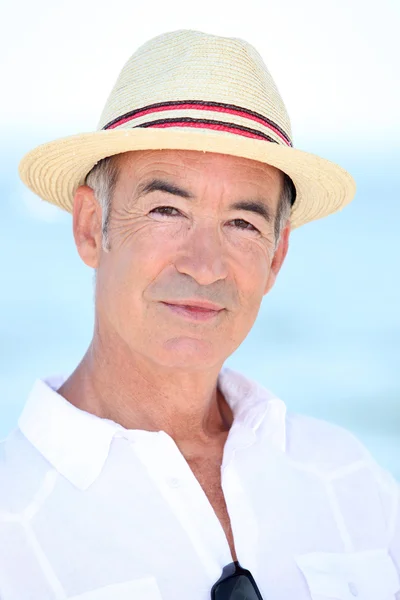 Older man in a straw panama hat — Stock Photo, Image