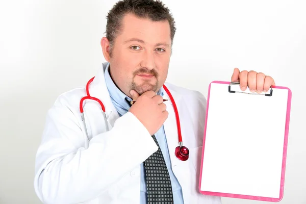 Confused male doctor holding clipboard — Stock Photo, Image