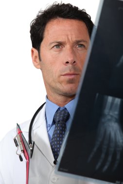 Doctor examining x rays clipart