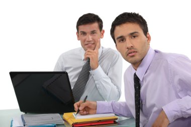 Duo of male executives in office clipart