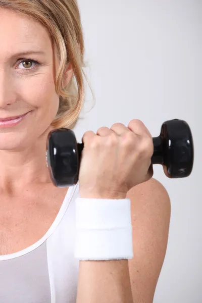 Closeup of woman with dumbbell — Stock Photo, Image
