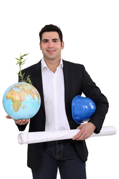 Architect holding globe and plans — Stock Photo, Image