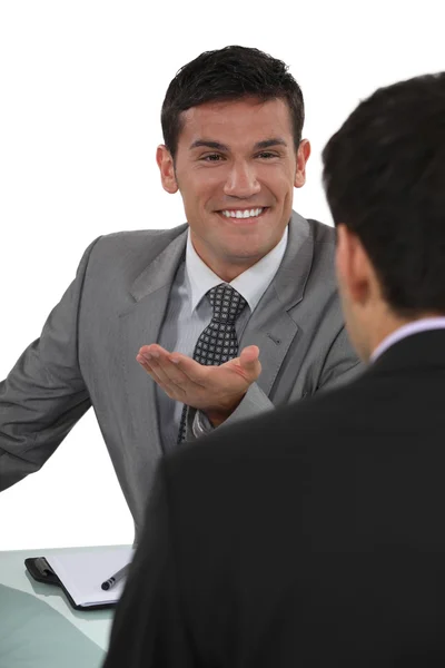 Businessman telling a joke to colleague — Stock Photo, Image