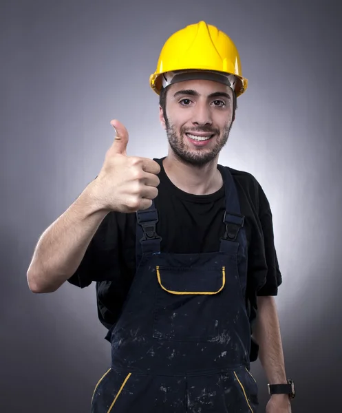 Усміхаючись працівник будівництва Стокове Фото