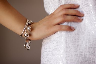 Bracelet jewelry on woman's arm clipart