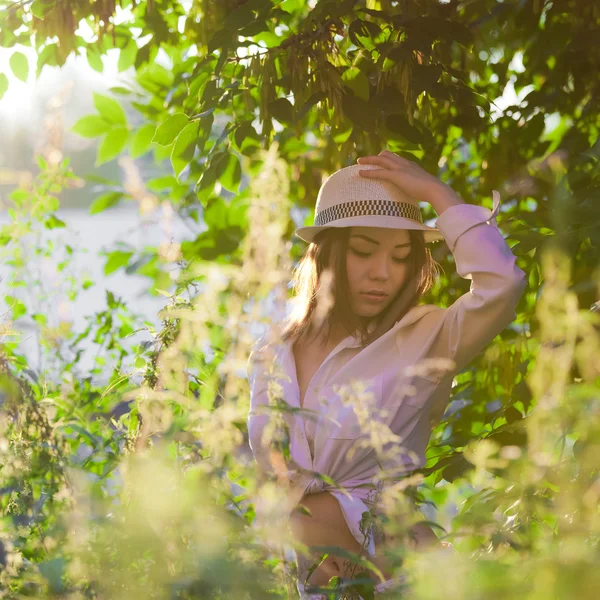 stock image Young girl in a white shirt and hat