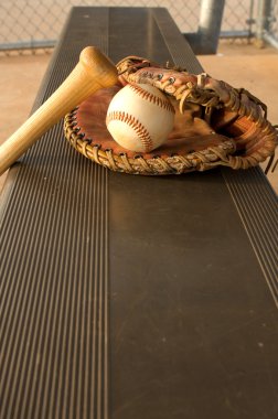 Baseball Bat and Glove in the Dugout clipart