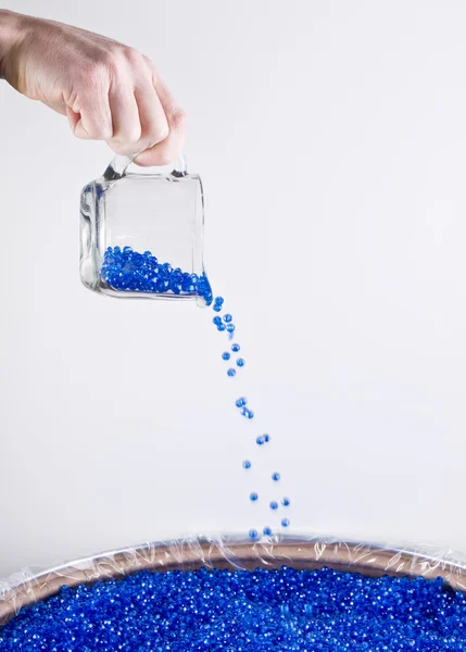 Pouring Plastic Colored Beads — Stock Photo, Image