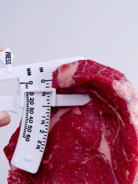 ステーキ垂直に脂肪のカリパス ロイヤリティフリーのストック画像