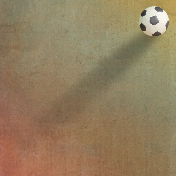 Football en plastique sur fond de vieux papier — Photo