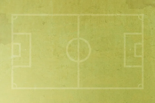 Футбольне поле на гранжевому паперовому фоні — стокове фото