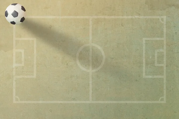 Modellera fotboll fotboll på papper fältet bakgrund — Stockfoto