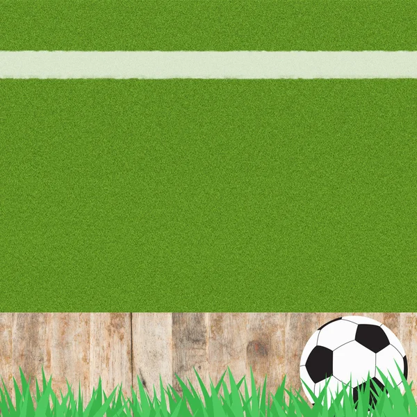 Futebol futebol na grama e fundo de madeira — Fotografia de Stock
