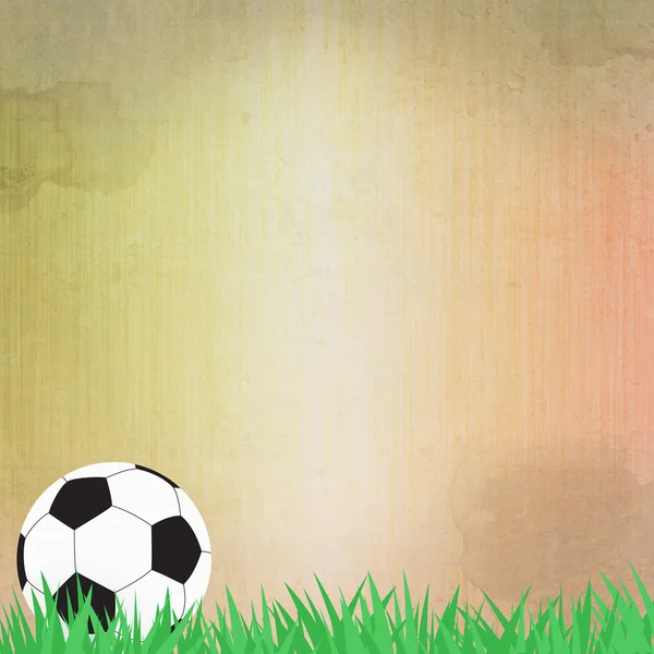 Ποδόσφαιρο μπάλα στο χόρτο και χαρτί υπόβαθρο — Φωτογραφία Αρχείου