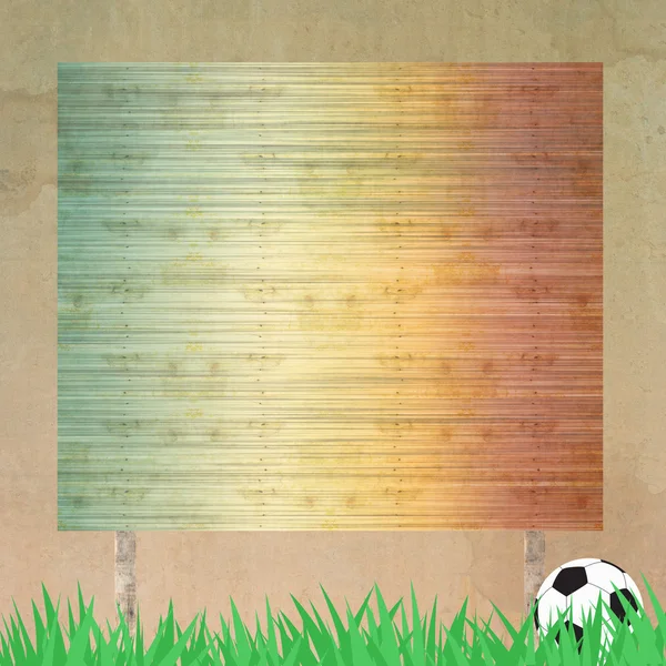 Fútbol y cartelera sobre hierba fondo y textura — Foto de Stock