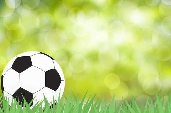 Ποδόσφαιρο με πράσινο γρασίδι σε αφηρημένο φόντο χρώμα — Φωτογραφία Αρχείου