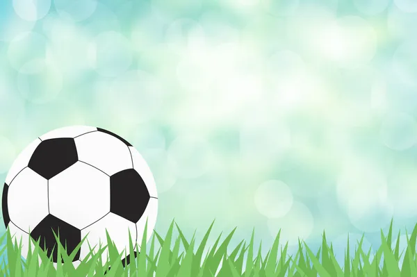 Fotboll med grönt gräs på färg abstrakt bakgrund — Stockfoto