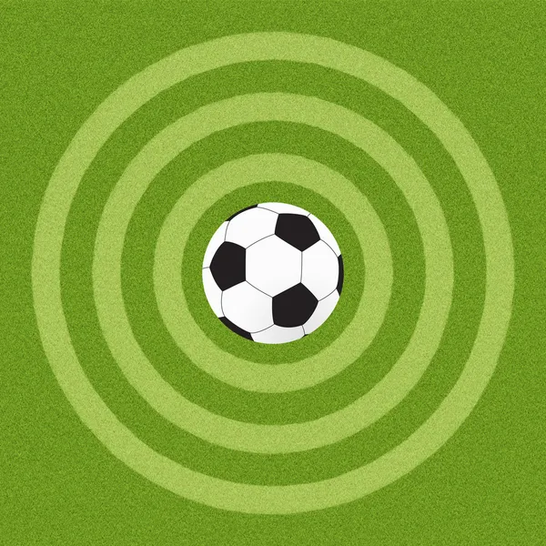 Футбол на фоні трави — стокове фото