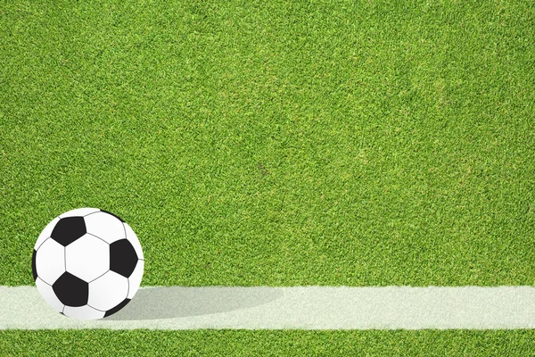 草の背景にサッカー — ストック写真