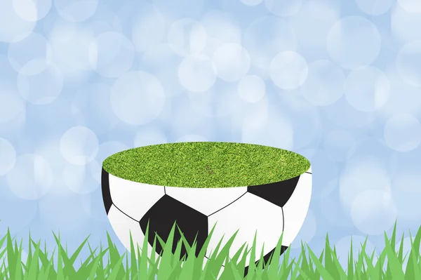Football avec herbe verte sur fond abstrait couleur — Photo