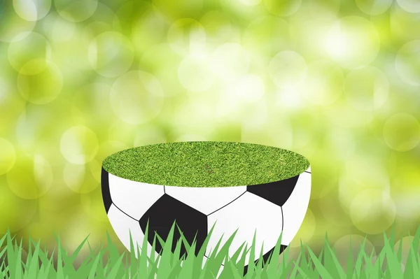 Fotboll med grönt gräs på färg abstrakt bakgrund — Stockfoto